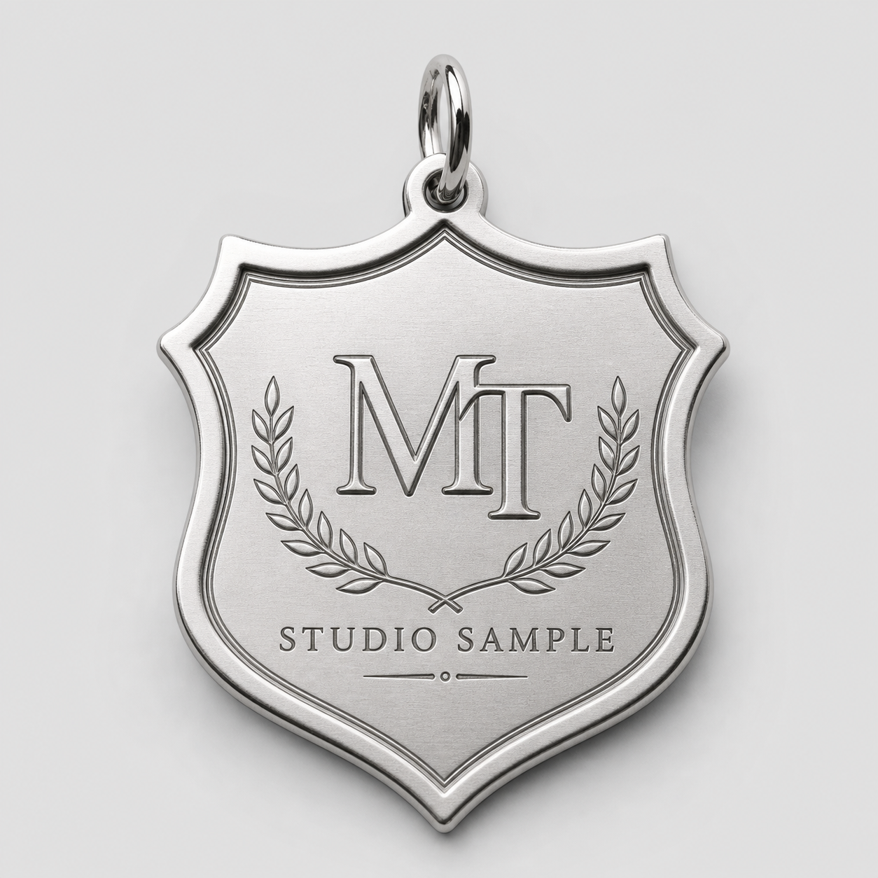 Silver shield logo metal tag